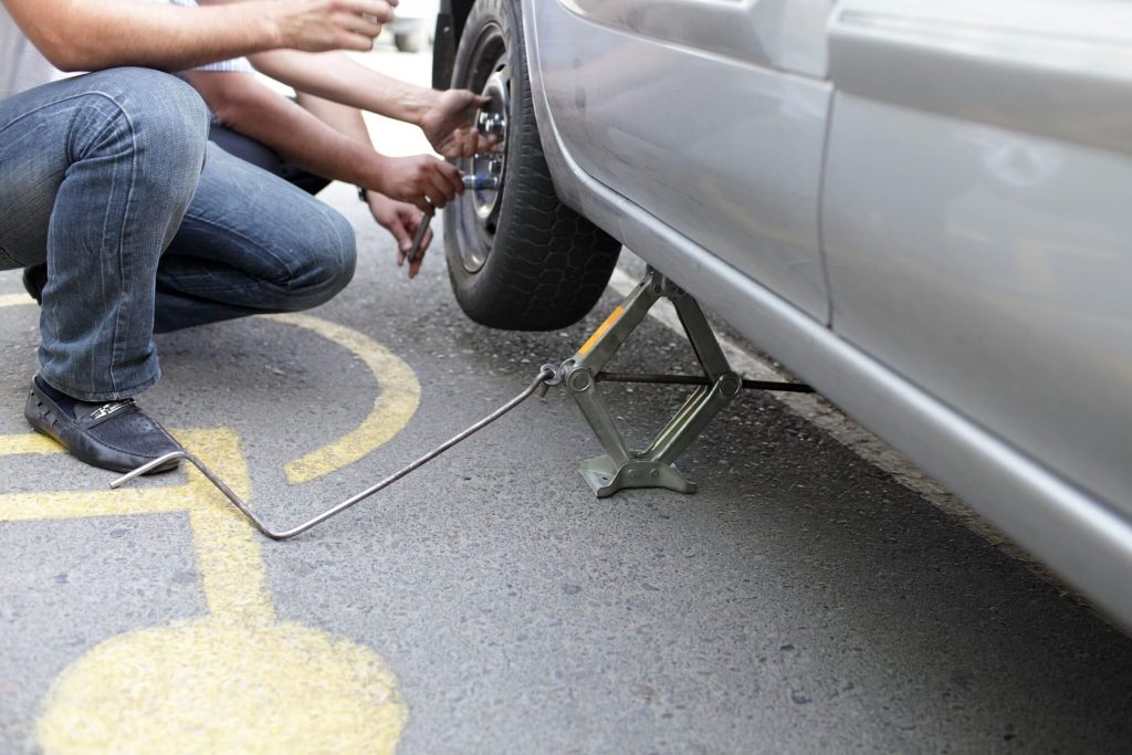 Man Changing A Tire